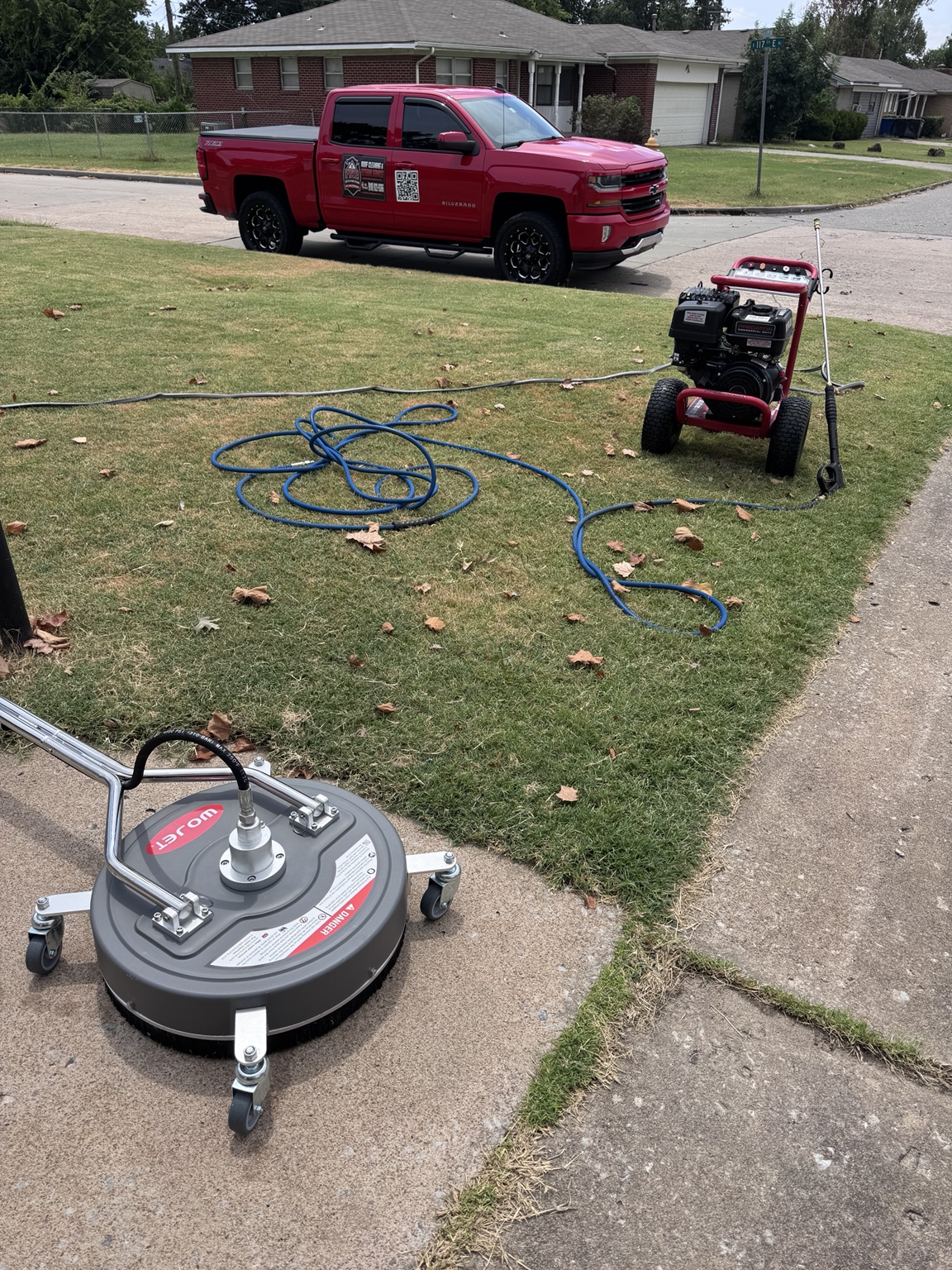 First In Response Exteriors truck and professional surface-cleaning equipment at a local job